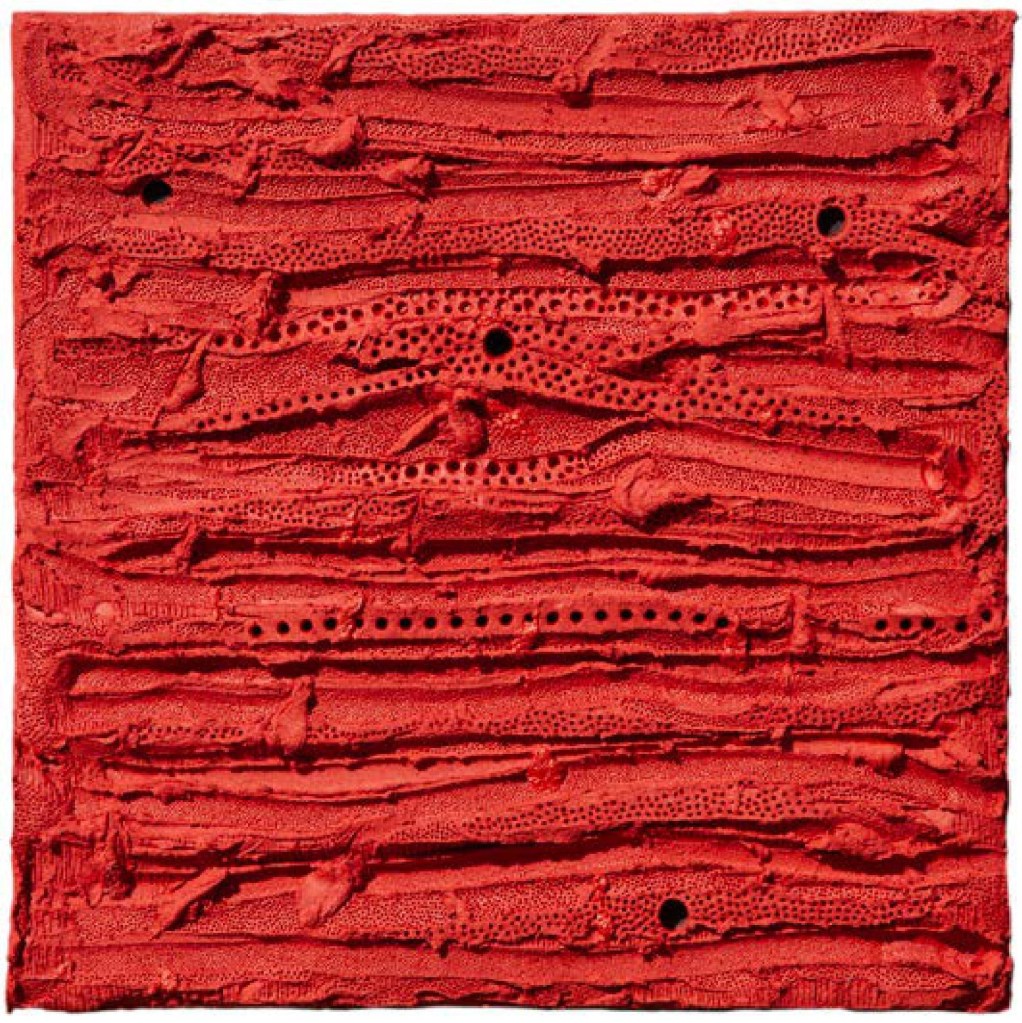 Textured abstract artwork featuring a vibrant red surface with horizontal lines and small holes.